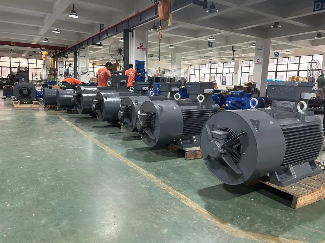 An industrial induction motor with a variable frequency drive in a factory setting.