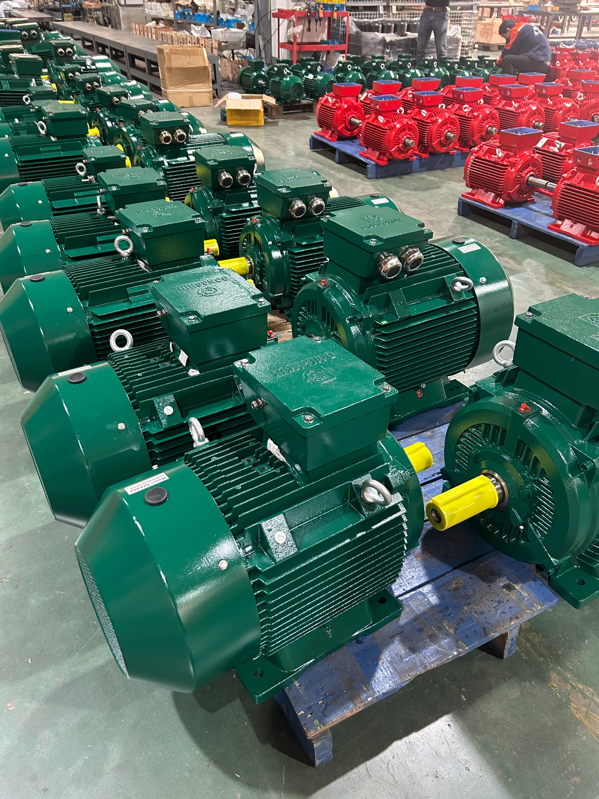 Twenty-foot container being loaded with palletized electric motors at Chinese factory export dock Container being loaded with electric motors at a Chinese factory shipping dock